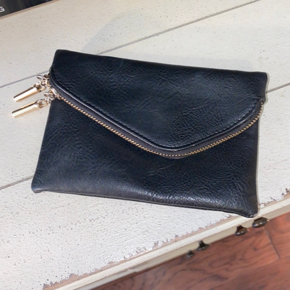 Black small handheld clutch gold metal zipper closure two pockets w/ credit card